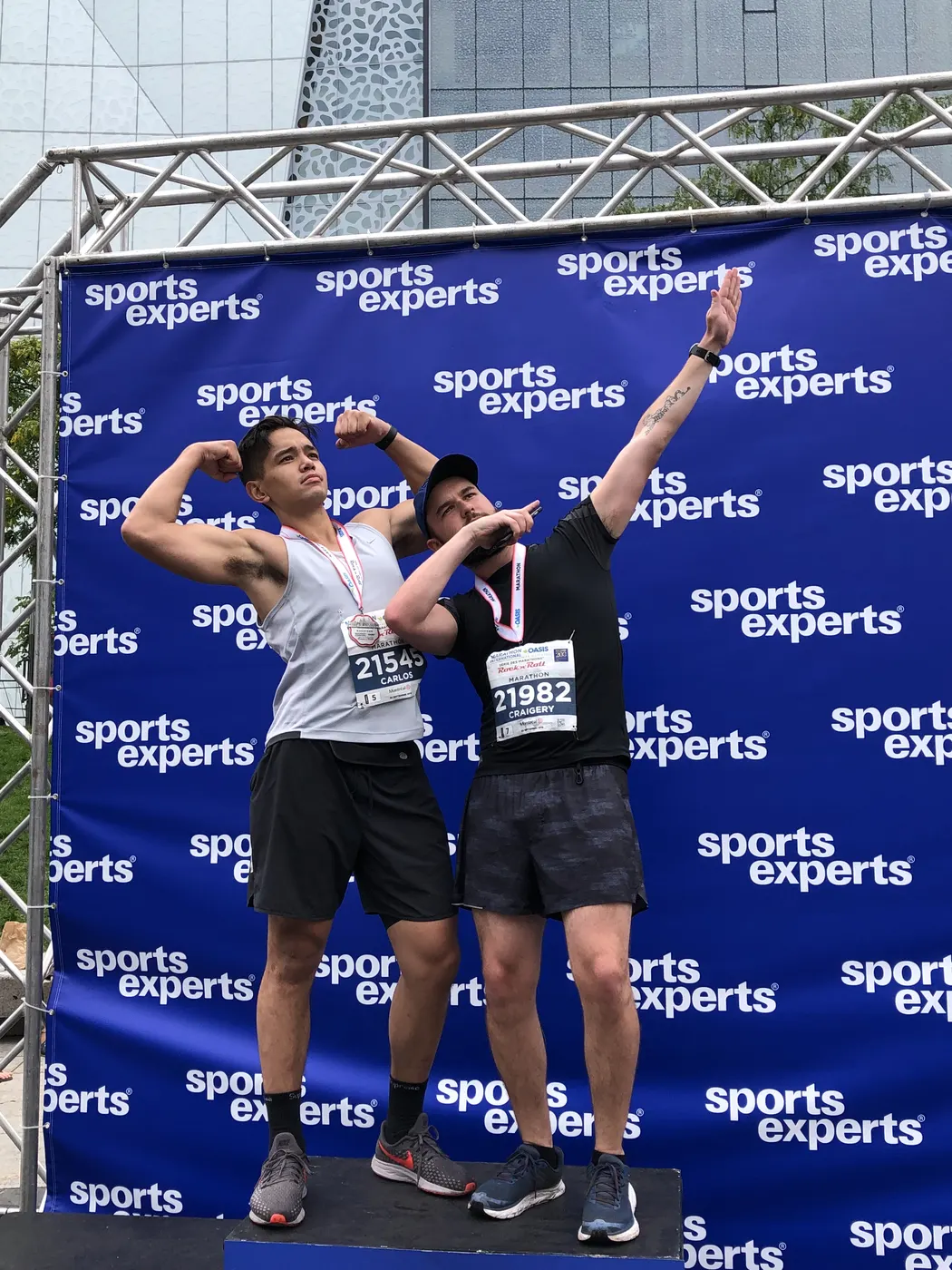 Carlos celebrating with his medal after his first marathon
